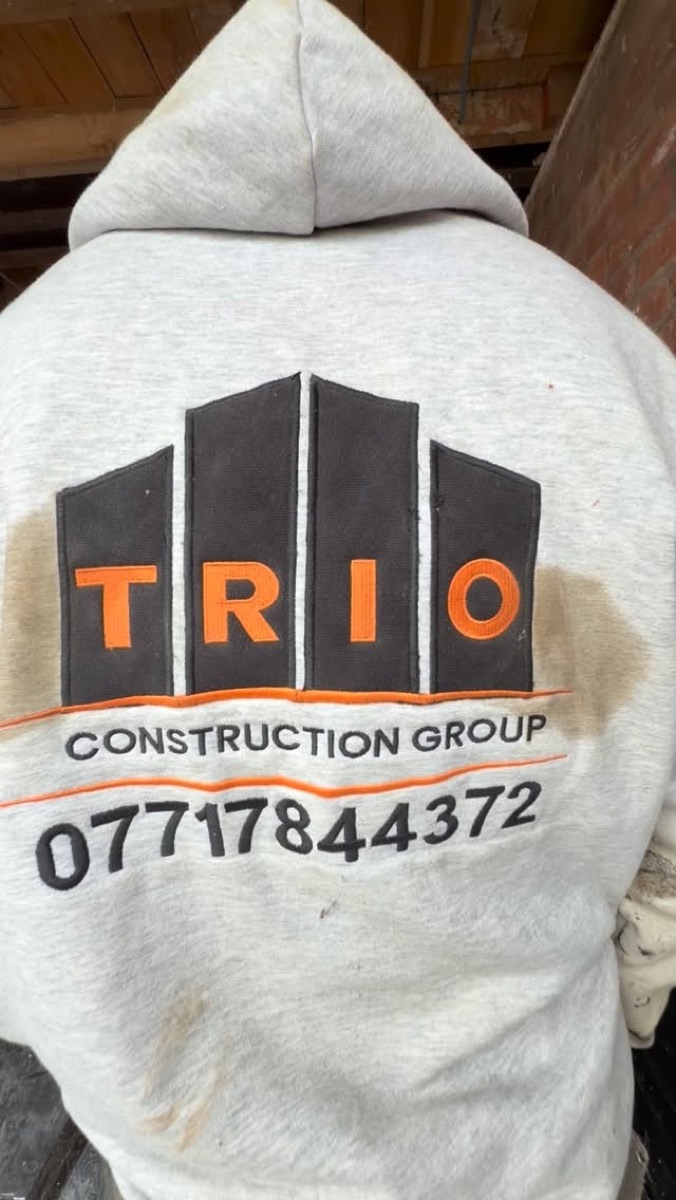 Trio Construction Group branded workwear on site