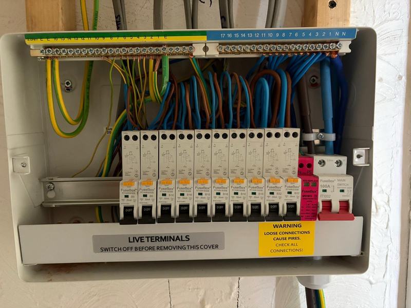 Consumer unit installation with the cover off during wiring