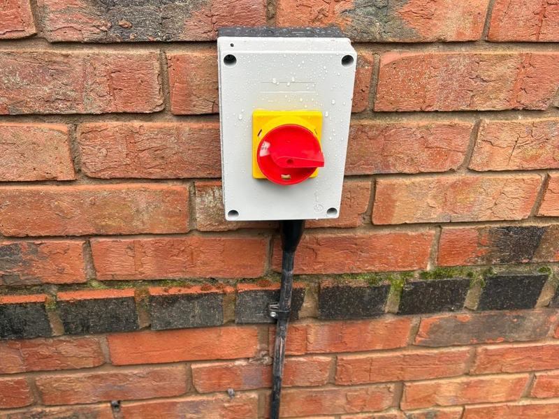 Outdoor rotary isolator mounted on brickwork